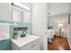 Bathroom with stylish sink and walk way into bedroom with great natural light from the window at 1120 Starline Se Dr, Smyrna, GA 30080