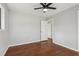 Bright bedroom with hardwood floors, ceiling fan, and multiple windows at 1120 Starline Se Dr, Smyrna, GA 30080