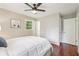Well-lit bedroom features wood floors, ceiling fan, and a window offering plenty of natural light at 1120 Starline Se Dr, Smyrna, GA 30080