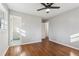 Spacious bedroom with hardwood floors and access to bathroom at 1120 Starline Se Dr, Smyrna, GA 30080