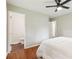 Bedroom with ceiling fan, wood floors and adjacent bathroom at 1120 Starline Se Dr, Smyrna, GA 30080