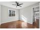 Spacious bedroom with hardwood floors, ceiling fan, and ample natural light at 1120 Starline Se Dr, Smyrna, GA 30080