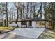 Recently renovated ranch home, featuring a white brick exterior and a covered carport at 1120 Starline Se Dr, Smyrna, GA 30080