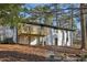 Rear exterior of home features a deck and a covered porch at 1120 Starline Se Dr, Smyrna, GA 30080