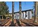 White brick house with a deck and tree-lined backyard at 1120 Starline Se Dr, Smyrna, GA 30080