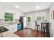 Bright kitchen features white cabinets, stainless appliances, granite counters, and adjacent breakfast area at 1120 Starline Se Dr, Smyrna, GA 30080