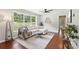 Comfortable living room featuring a modern sofa, area rug, and large window at 1120 Starline Se Dr, Smyrna, GA 30080