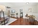 Bright living room with hardwood floors, access to kitchen, and stylish decor at 1120 Starline Se Dr, Smyrna, GA 30080