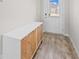 Bright entryway with contemporary storage cabinet and wood-look floors at 12 Enclave Blvd, Covington, GA 30014