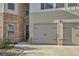 Two-car garage with gray doors and black hardware at 12 Enclave Blvd, Covington, GA 30014