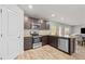 Modern kitchen features stainless steel appliances and granite countertops at 12 Enclave Blvd, Covington, GA 30014