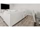 Open living area with large sectional sofa and hardwood floors at 12 Enclave Blvd, Covington, GA 30014