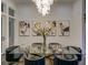 Modern dining room with glass table and statement chandelier at 55 Serendipity Way, Atlanta, GA 30350