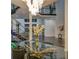 Elegant dining area with glass top table and modern chandelier at 55 Serendipity Way, Atlanta, GA 30350