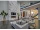 Two story living room with marble fireplace and modern furniture at 55 Serendipity Way, Atlanta, GA 30350