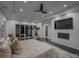 Main bedroom features a large TV, fireplace, and sliding glass doors at 55 Serendipity Way, Atlanta, GA 30350
