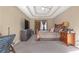 Primary bedroom with carpeted floor, large bed, and workspace at 2618 Windage Sw Dr, Marietta, GA 30008