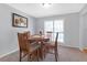Dining room with hardwood floors, a round table and four chairs, and a large window at 2618 Windage Sw Dr, Marietta, GA 30008