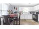 Bright eat-in kitchen with white cabinets and tile floor at 2618 Windage Sw Dr, Marietta, GA 30008