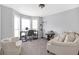Home office with built-in shelving, a comfortable seating area, and a bay window at 2618 Windage Sw Dr, Marietta, GA 30008