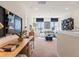 Open concept study with built-in shelving and a desk at 3229 Shirecrest Ln, Dacula, GA 30019