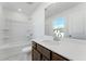 Bathroom features a tub-shower combination, vanity, and a bright window at 238 Lytham Se Dr, Mableton, GA 30126