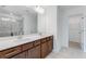 Bathroom featuring a double sink vanity, large mirror, and a walk-in shower at 238 Lytham Se Dr, Mableton, GA 30126