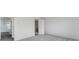 Spacious bedroom with neutral carpet and an open doorway to the en suite bathroom at 238 Lytham Se Dr, Mableton, GA 30126