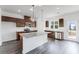 Modern kitchen features granite countertops, stainless appliances, and dark cabinets at 238 Lytham Se Dr, Mableton, GA 30126