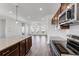Close up shot of kitchen with granite countertops, stainless appliances, and dark cabinets at 238 Lytham Se Dr, Mableton, GA 30126