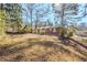 House with backyard, mature trees and grassy area at 2839 Allegro Nw Dr, Atlanta, GA 30318