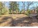 Large backyard with mature trees and grassy area at 2839 Allegro Nw Dr, Atlanta, GA 30318