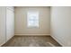 Well-lit bedroom with neutral walls and carpet at 2839 Allegro Nw Dr, Atlanta, GA 30318
