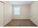 Light-filled bedroom with carpet and closet at 2839 Allegro Nw Dr, Atlanta, GA 30318