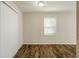Bright bedroom with wood-look flooring and sliding door at 2839 Allegro Nw Dr, Atlanta, GA 30318