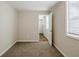 Bright bedroom with carpet and access to hallway at 2839 Allegro Nw Dr, Atlanta, GA 30318