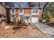 Brick house with attached garage and driveway at 2839 Allegro Nw Dr, Atlanta, GA 30318