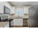 Modern kitchen with granite countertops and stainless steel appliances at 2839 Allegro Nw Dr, Atlanta, GA 30318
