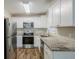 Modern kitchen with granite countertops and stainless steel appliances at 2839 Allegro Nw Dr, Atlanta, GA 30318