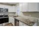 Modern kitchen with granite countertops and stainless steel appliances at 2839 Allegro Nw Dr, Atlanta, GA 30318