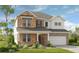 Two-story brick home with stone accents and a large front yard at 3219 Shirecrest Ln, Dacula, GA 30019