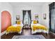 Bedroom with two twin beds and a colorful rug at 516 Arthur Sw St, Atlanta, GA 30310