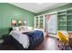 Bright bedroom with built-in shelves and hardwood floors at 516 Arthur Sw St, Atlanta, GA 30310