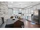 Modern kitchen with gray cabinets, stainless steel appliances, and hardwood floors at 516 Arthur Sw St, Atlanta, GA 30310