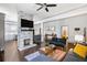 Open concept living room with kitchen view and fireplace at 516 Arthur Sw St, Atlanta, GA 30310