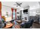 Open living room with stone fireplace and hardwood floors at 516 Arthur Sw St, Atlanta, GA 30310