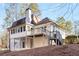 Two-story house with a deck and a large backyard at 8120 Tynecastle Dr, Atlanta, GA 30350