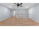 Bright bonus room featuring hardwood floors and a ceiling fan at 3266 Spicy Cedar Ln, Lithonia, GA 30038