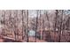 Scenic backyard with dense trees and a small creek or stream running through it at 1030 Lake Haynes Ne Dr, Conyers, GA 30012