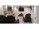 Finished basement with home theater seating, wet bar, recessed lighting, and plank flooring at 1030 Lake Haynes Ne Dr, Conyers, GA 30012